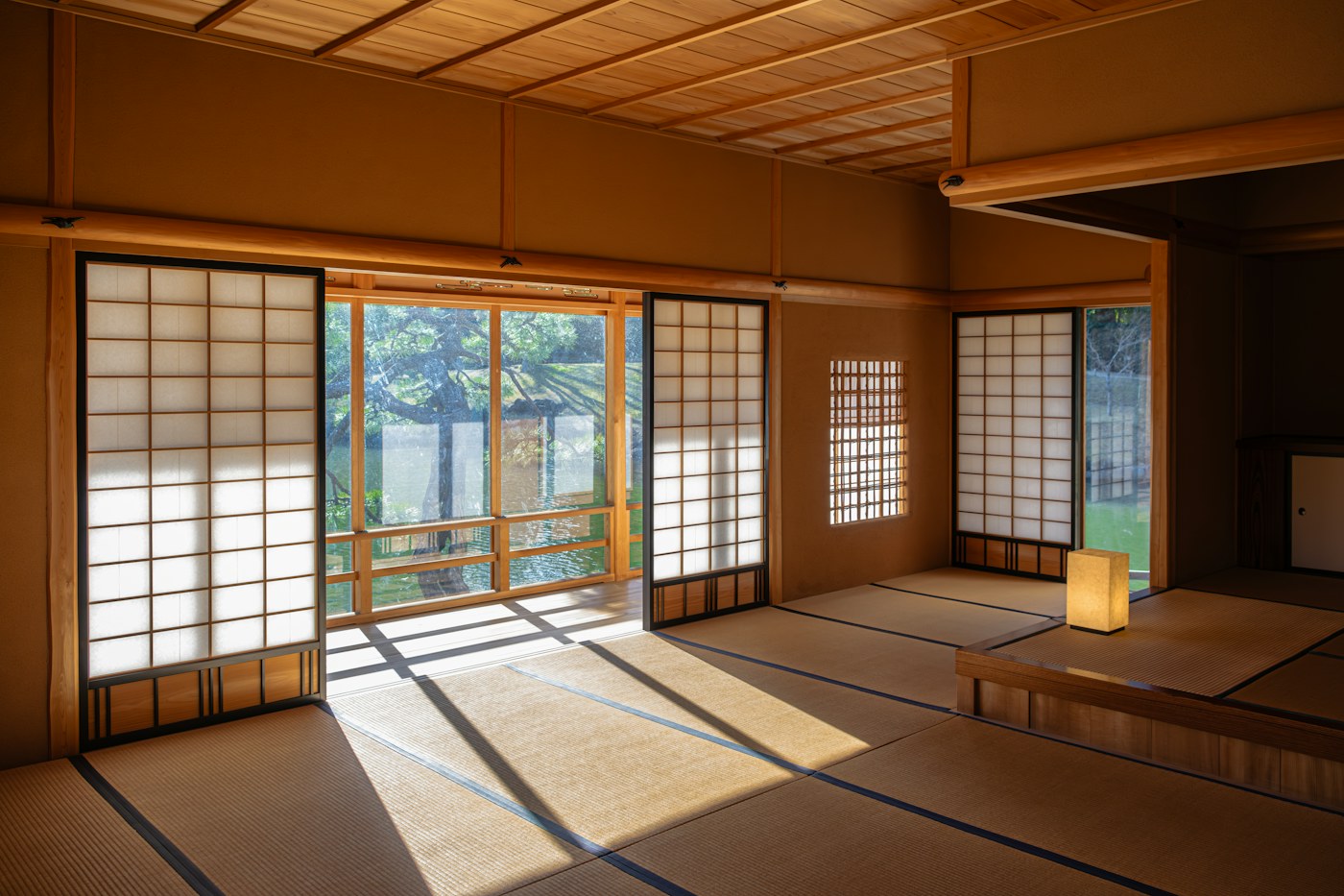 Minimal Japanese room with tatami, timber and sliding doors