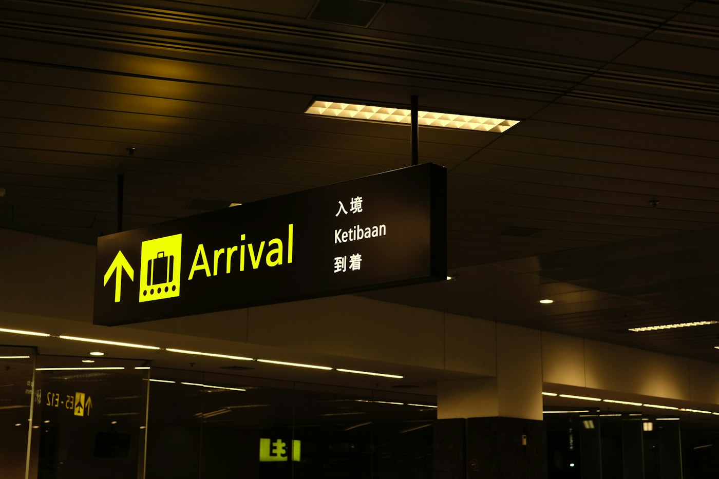Yellow and black airport directional signage